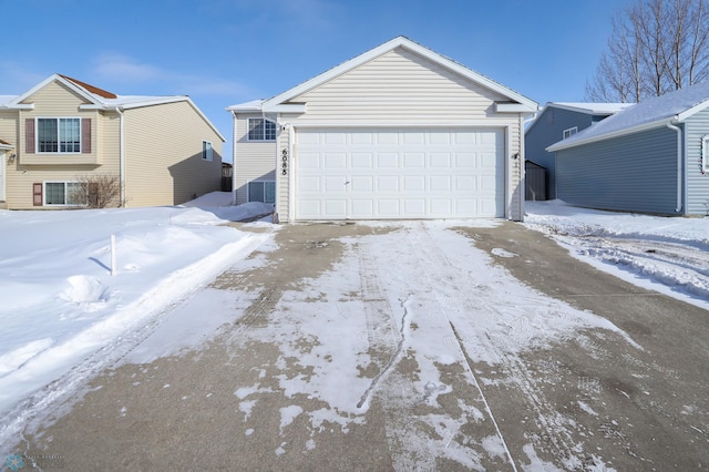 view of snow covered garage