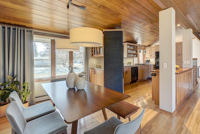 dining space featuring wood ceiling, a baseboard heating unit, light wood-style floors, and vaulted ceiling