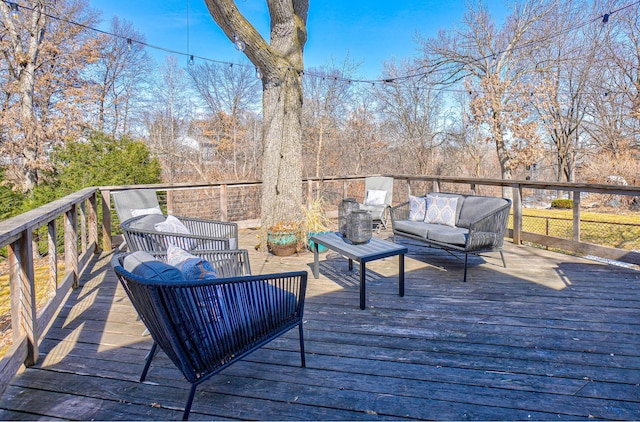 wooden terrace with an outdoor hangout area