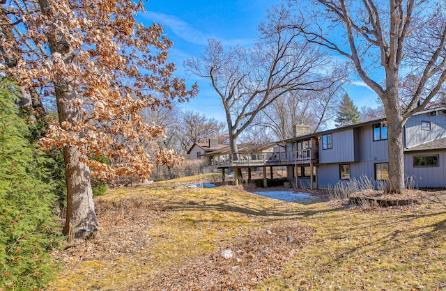 view of yard with a wooden deck