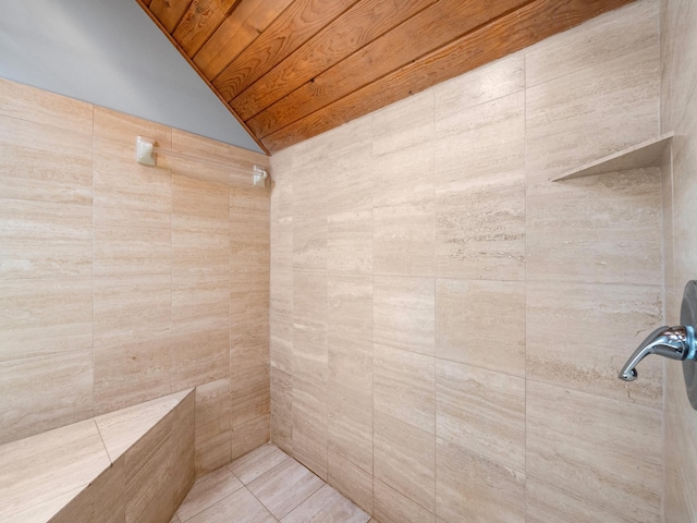 full bathroom with lofted ceiling, wood ceiling, and tiled shower