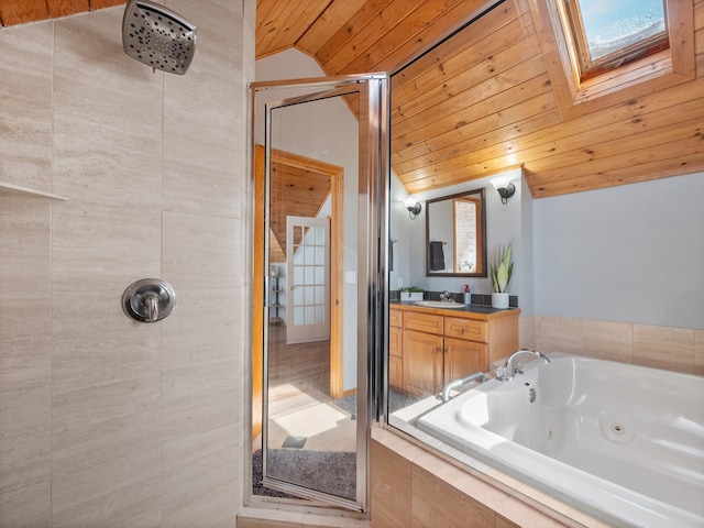 bathroom featuring vaulted ceiling with skylight, wooden ceiling, a whirlpool tub, vanity, and a shower stall