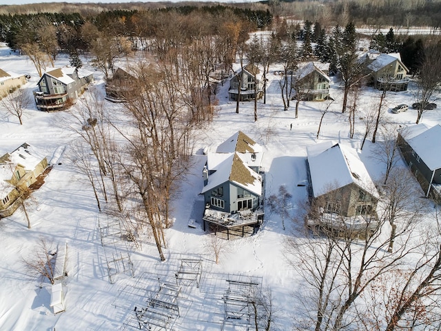 snowy aerial view featuring a residential view