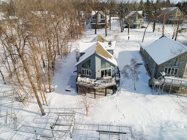 snowy aerial view with a residential view