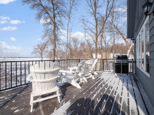 snow covered deck with grilling area