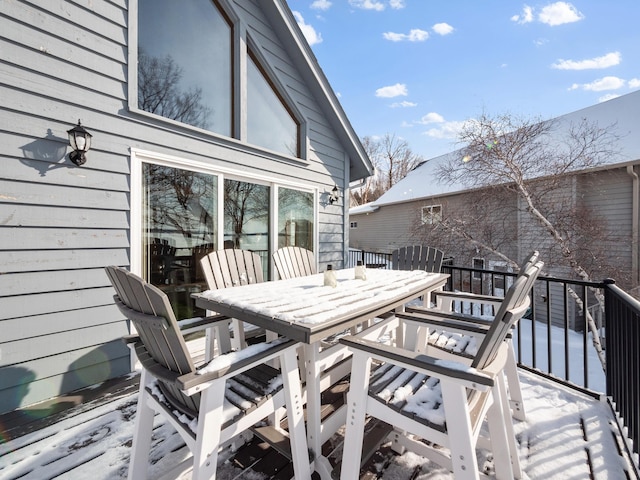 wooden deck featuring outdoor dining space