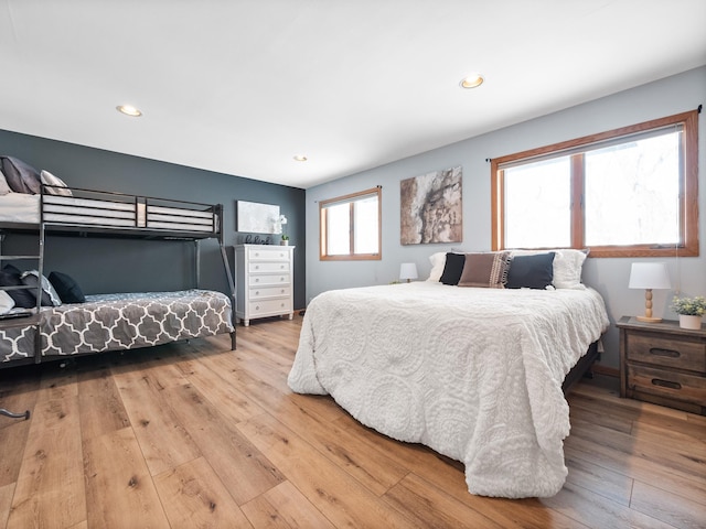 bedroom with recessed lighting and wood-type flooring