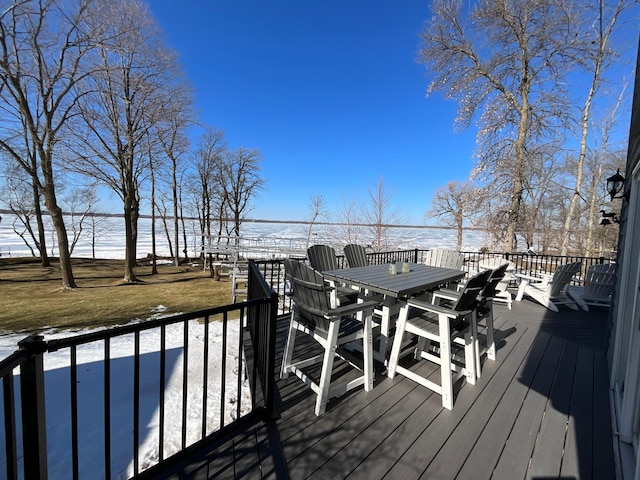 wooden terrace featuring outdoor dining area