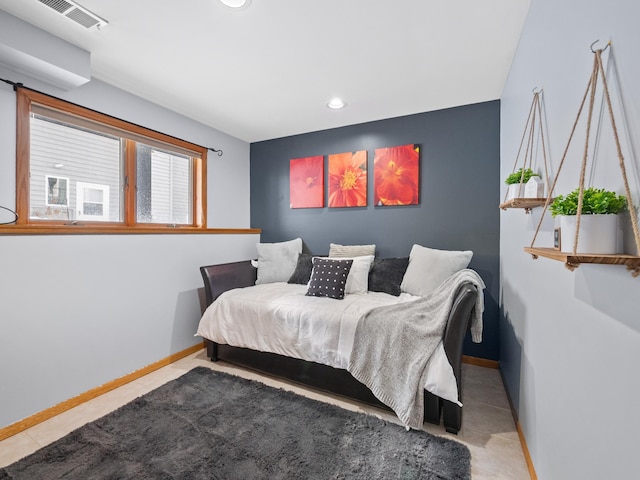 tiled bedroom featuring visible vents, recessed lighting, and baseboards