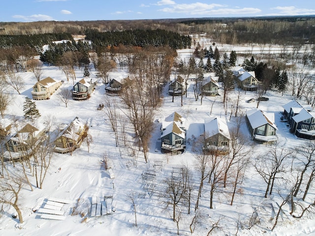 snowy aerial view with a residential view