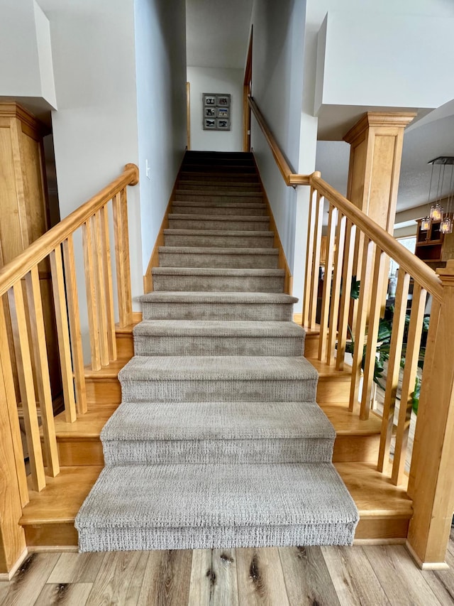 staircase with wood finished floors