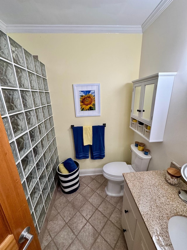 bathroom with ornamental molding, baseboards, vanity, and toilet