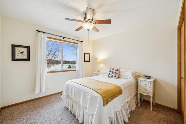 bedroom featuring carpet, ceiling fan, a textured ceiling, and baseboards