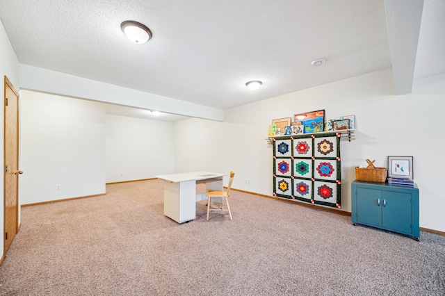 home office with a textured ceiling, baseboards, and carpet flooring