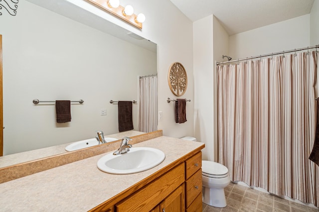 bathroom with a shower with shower curtain, vanity, and toilet