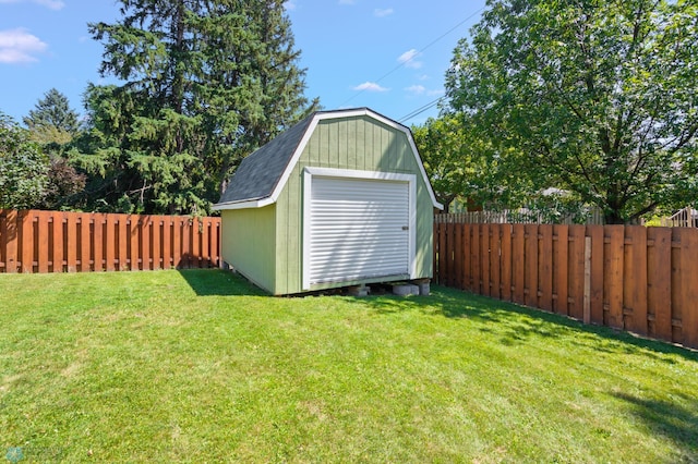 view of outbuilding featuring a yard