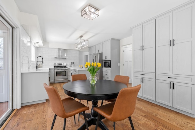 dining room with light wood-type flooring