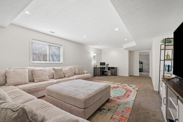 living area with light carpet, recessed lighting, a textured ceiling, and baseboards