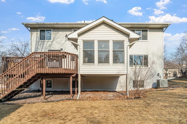 back of property with stairs, cooling unit, a lawn, and a wooden deck