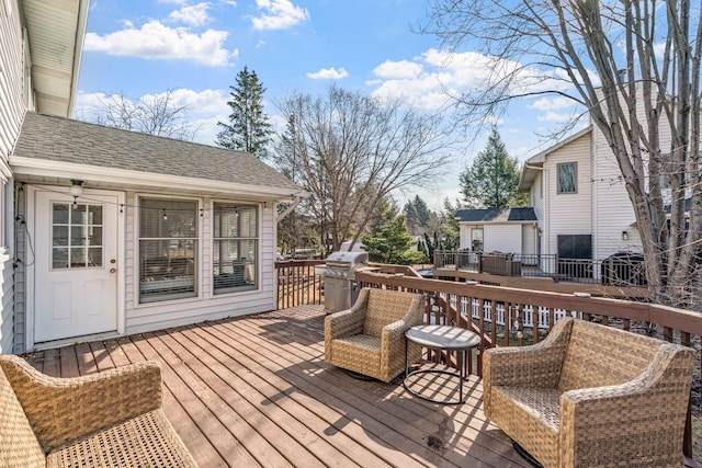 wooden terrace featuring area for grilling