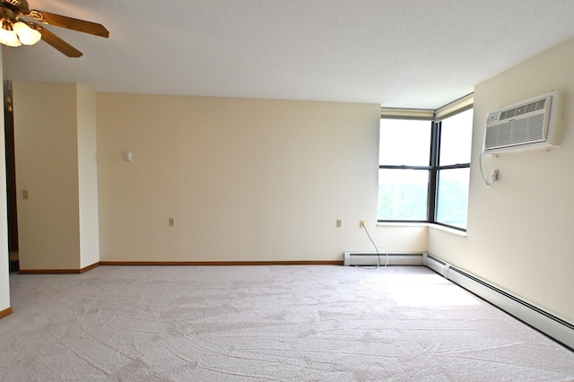 empty room featuring ceiling fan, a baseboard heating unit, light carpet, and a wall unit AC