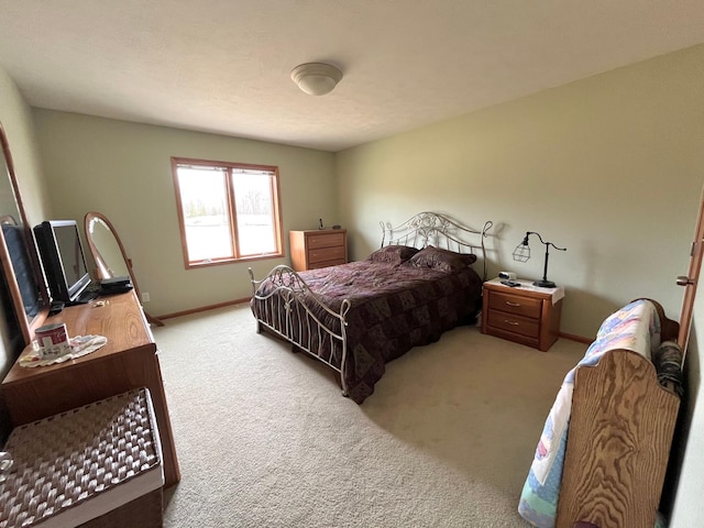 carpeted bedroom with baseboards