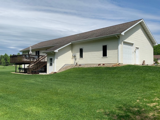 rear view of house with stairway, a yard, and a deck