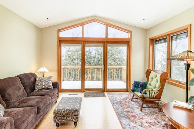 living room featuring lofted ceiling