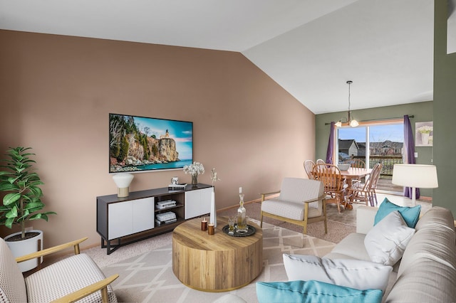 living area with light colored carpet, baseboards, lofted ceiling, and an inviting chandelier