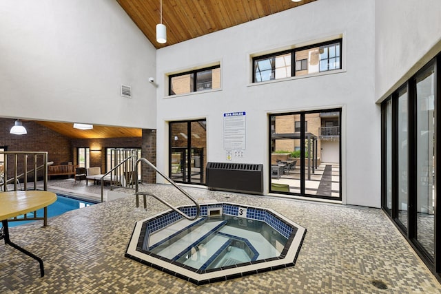 pool featuring an indoor hot tub