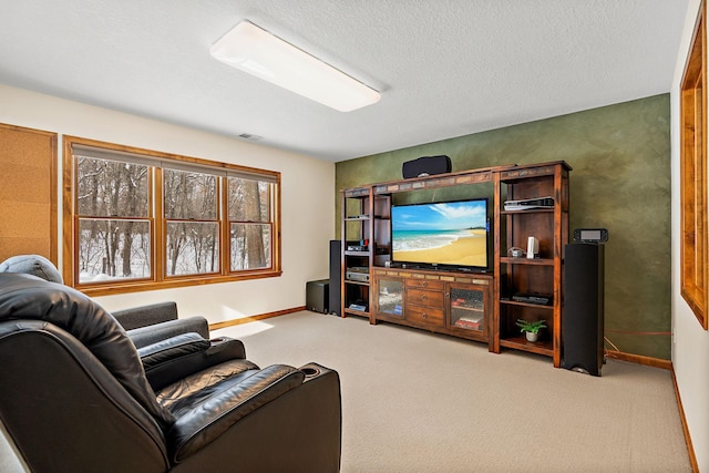 living area with light carpet, a textured ceiling, visible vents, and baseboards