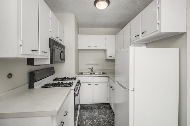 kitchen featuring sink, white appliances, a textured ceiling, and white cabinets