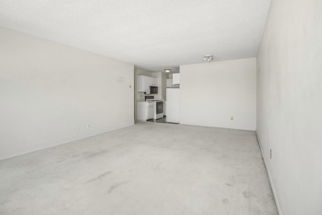 unfurnished living room with a textured ceiling