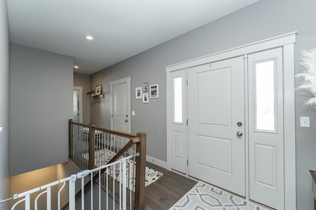 entryway with recessed lighting, baseboards, and wood finished floors