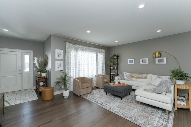 living area with recessed lighting and wood finished floors