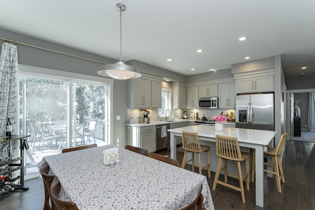 dining space with dark wood-style floors and recessed lighting