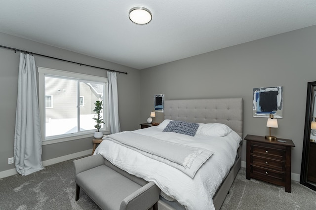 bedroom featuring baseboards and carpet