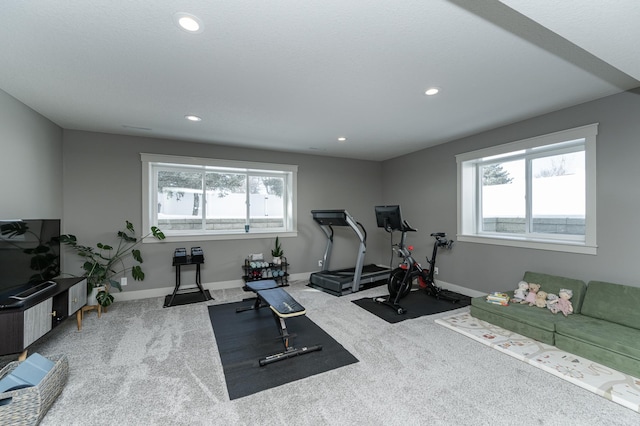 exercise area featuring recessed lighting, baseboards, and carpet