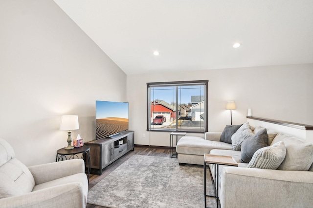 living room featuring lofted ceiling, baseboards, wood finished floors, and recessed lighting