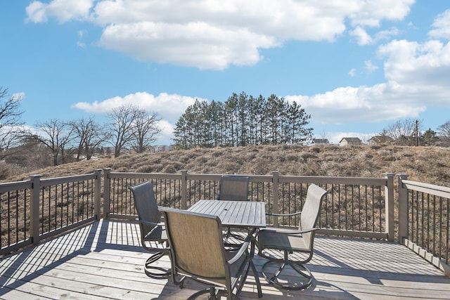 wooden deck featuring outdoor dining space