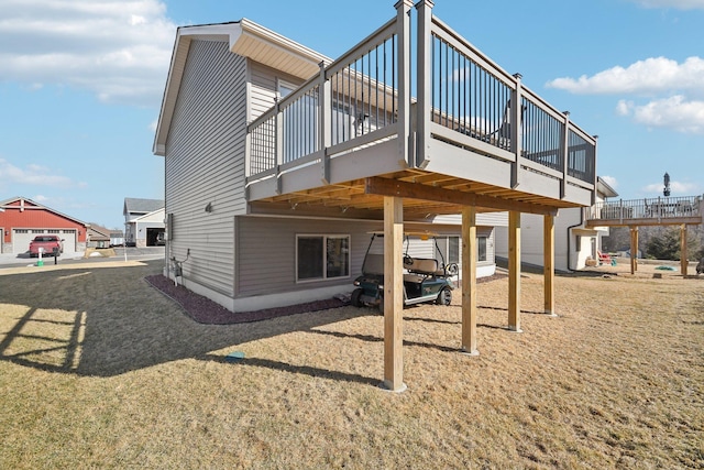 back of house featuring a wooden deck