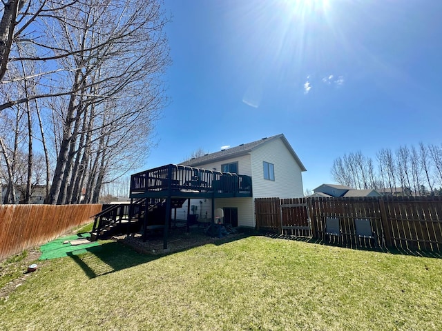 back of house with a wooden deck and stairs