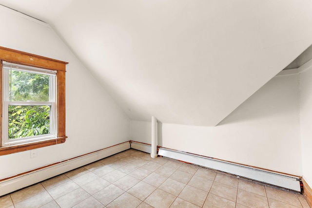 1498 Sherburne Ave, Saint Paul, MN 55104 - additional living space with vaulted ceiling, baseboard heating, and light tile patterned floors