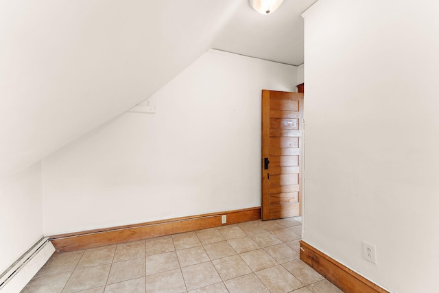 1498 Sherburne Ave, Saint Paul, MN 55104 - additional living space with baseboard heating, baseboards, vaulted ceiling, and light tile patterned flooring