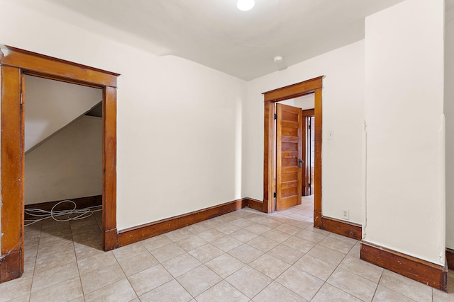1498 Sherburne Ave, Saint Paul, MN 55104 - spare room featuring light tile patterned floors, baseboards, and a smoke detector