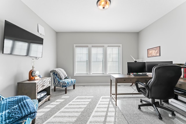 office with light colored carpet and baseboards