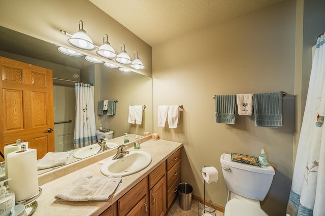 full bathroom featuring a textured ceiling, curtained shower, toilet, vanity, and baseboards