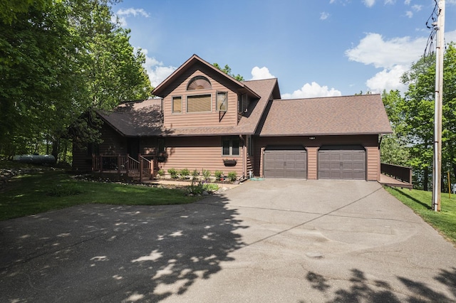 31628 Pickerel Lake Rd, Detroit Lakes, MN 56501 - view of front of property featuring a garage, driveway, a front lawn, and roof with shingles