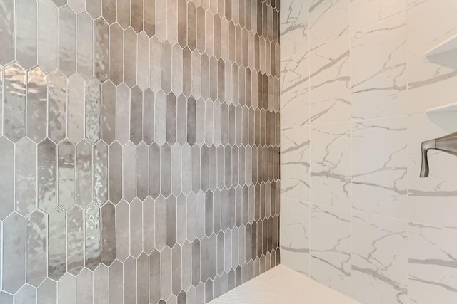 bathroom with a tile shower