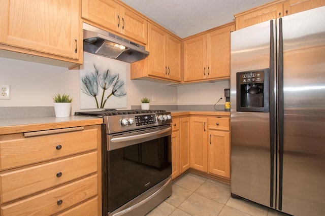 8075 211th Ave NW, Nowthen, MN 55330 - kitchen with stainless steel appliances, under cabinet range hood, light tile patterned flooring, light countertops, and light brown cabinetry